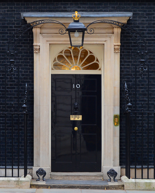Photograph of the door to 10 Downing Street. Photo taken in 2013 by Sergeant Tom Robinson RLC. Contains public sector information licensed under the Open Government Licence v3.0.